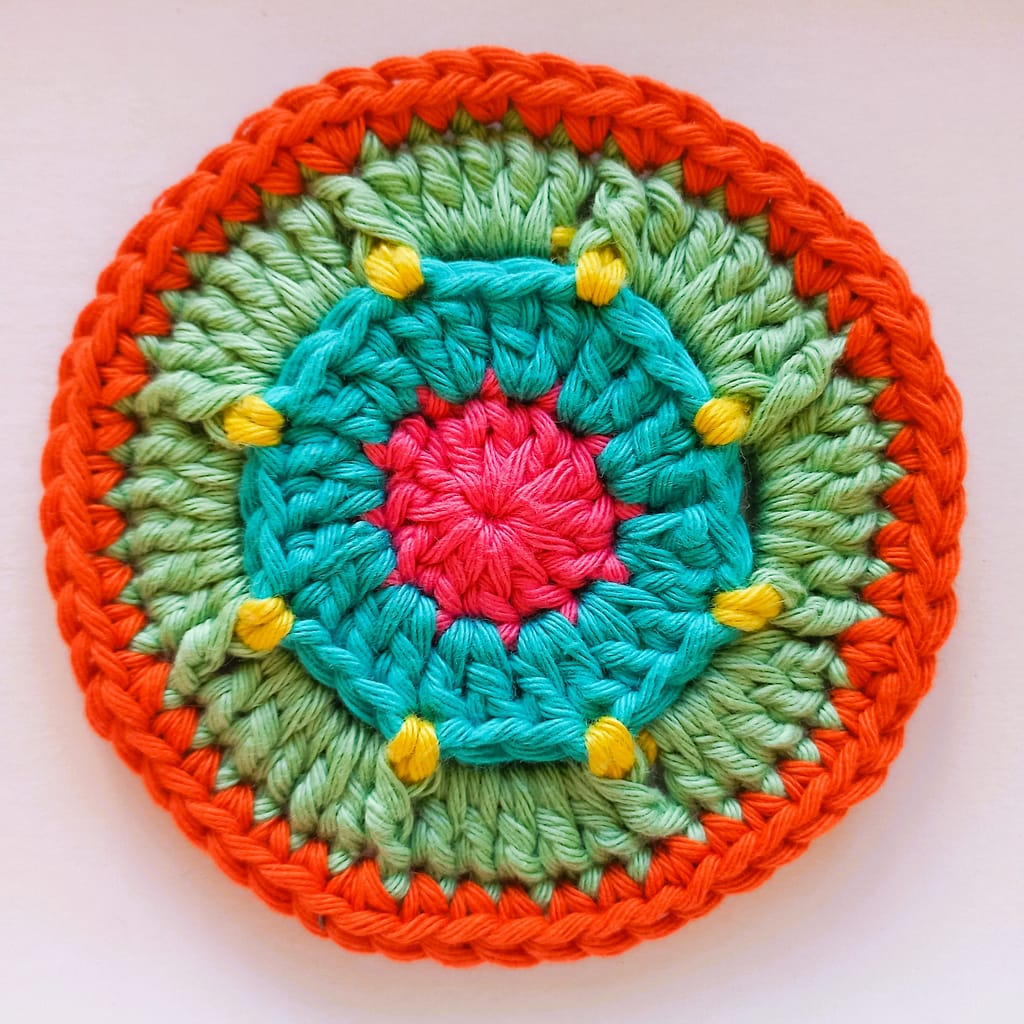 5th round of the crochet coaster completed