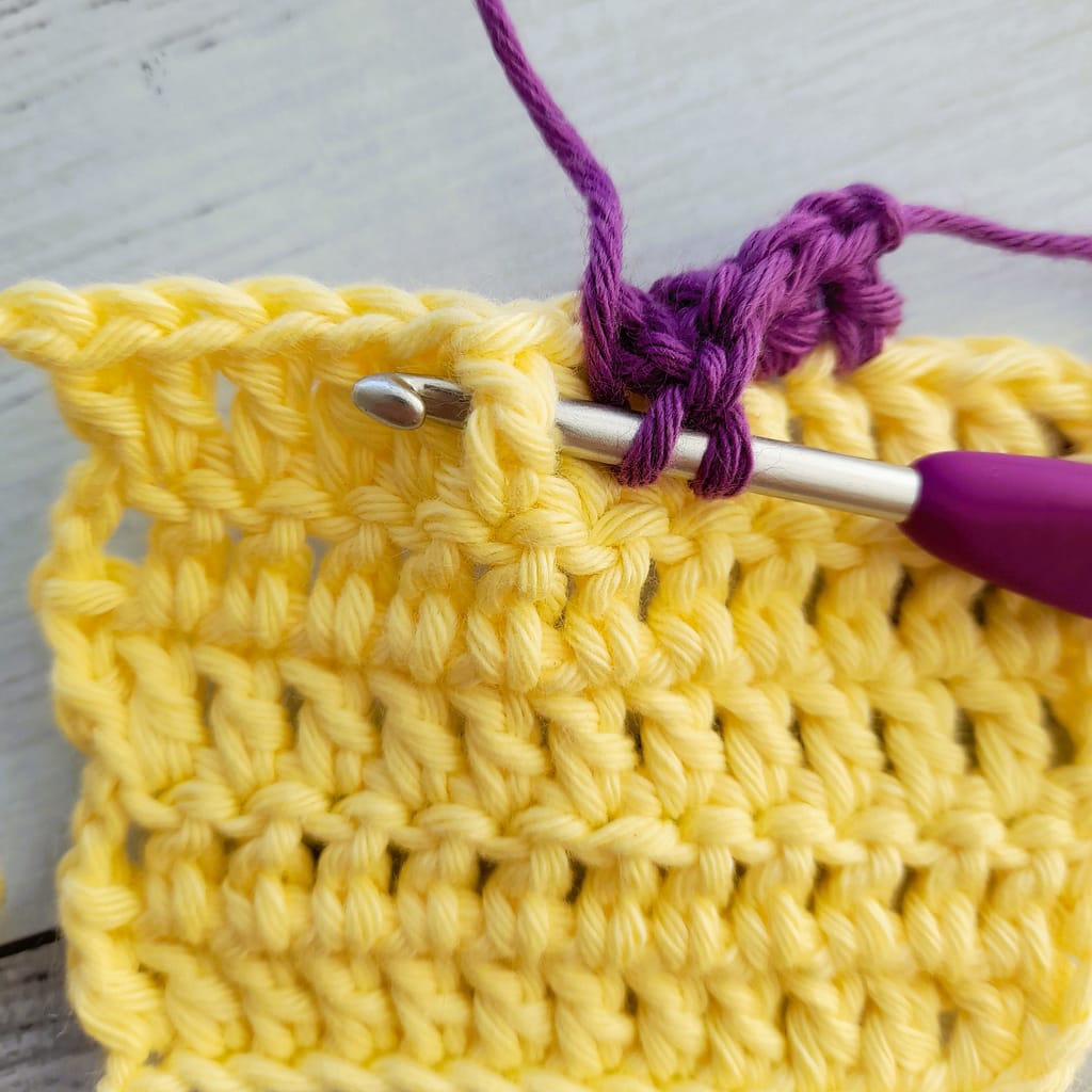 first step of a front post double crochet stitch