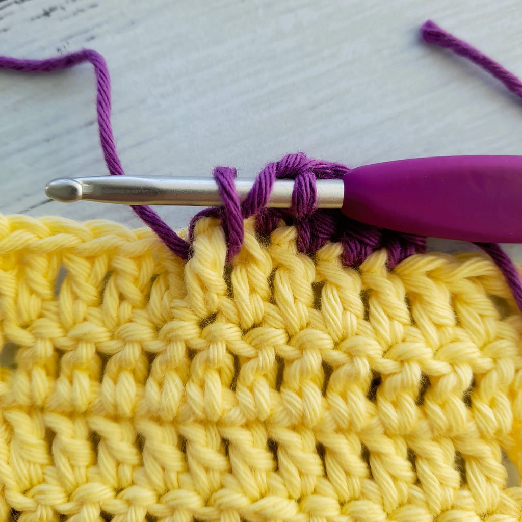 second step of a front post double crochet stitch