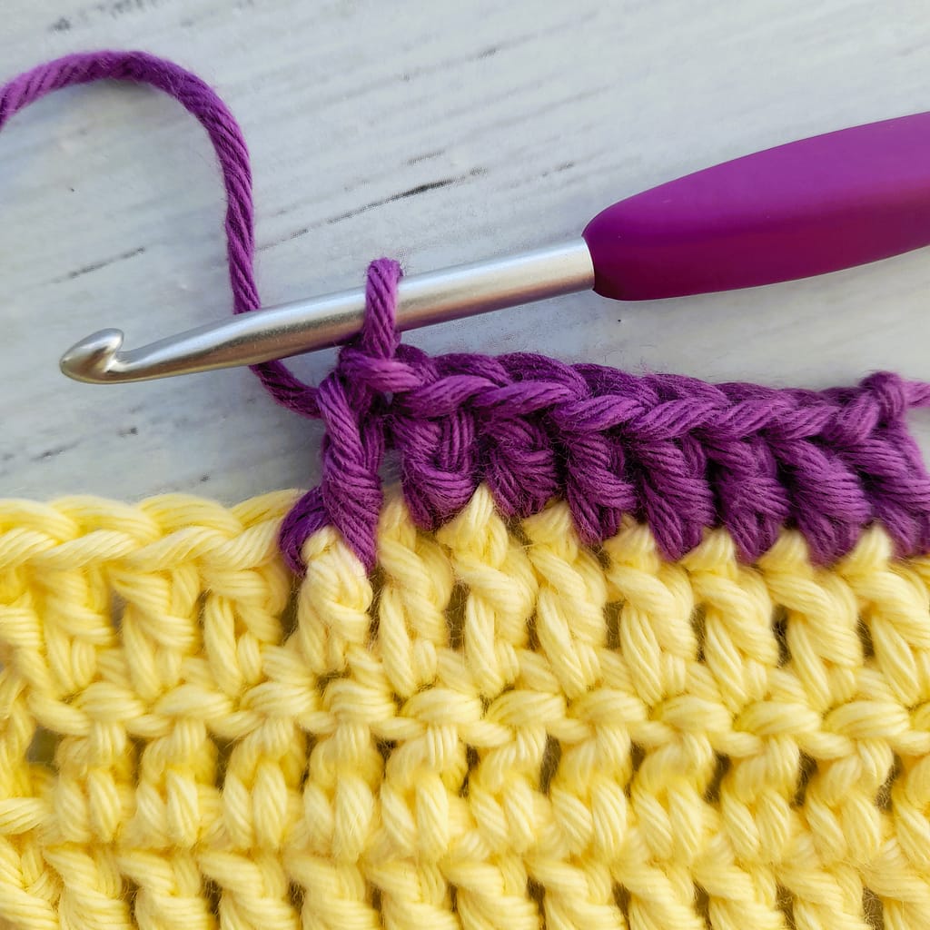 thrid step of a front post double crochet stitch