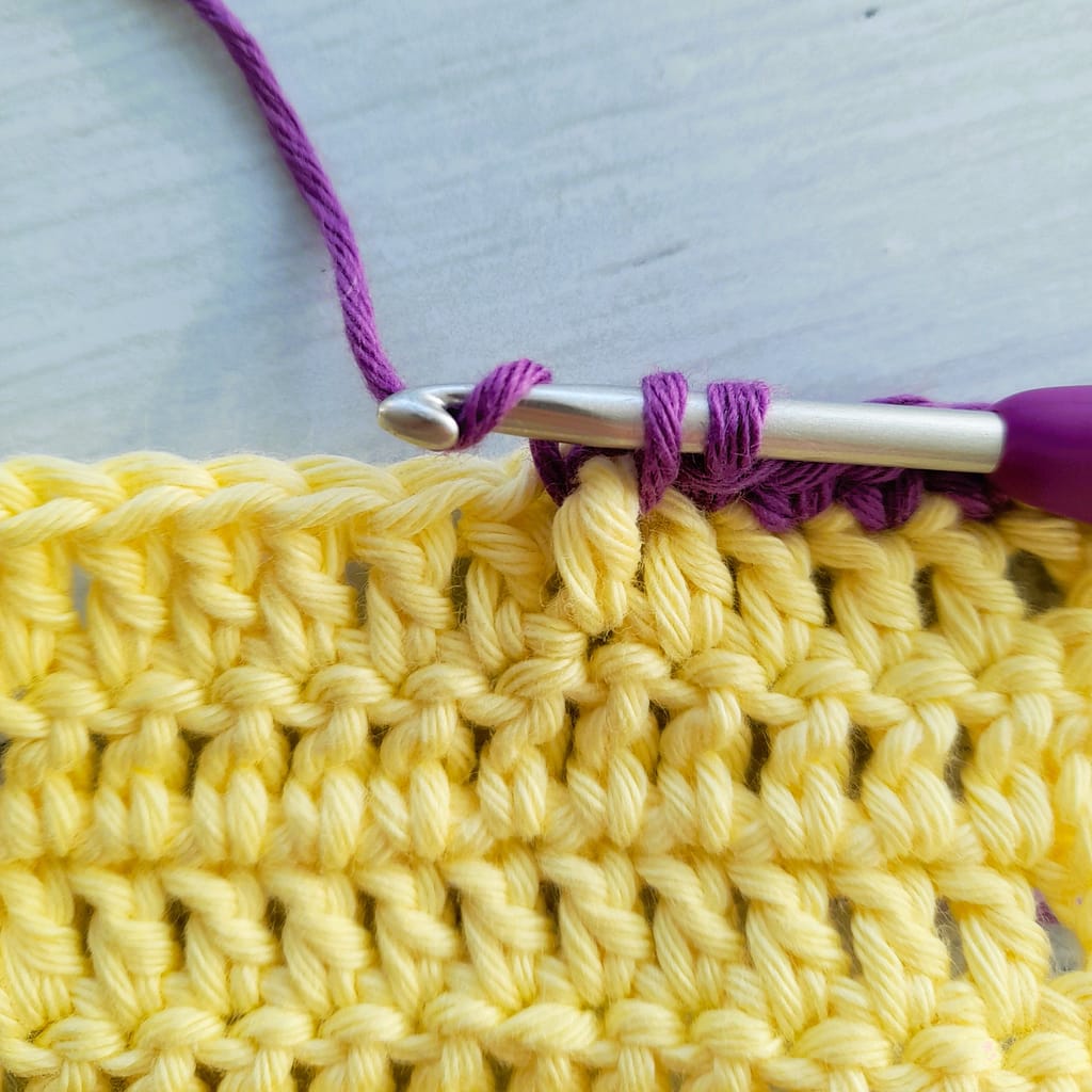 second step of a front post single crochet stitch