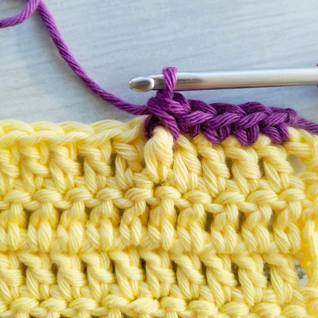 third step of a front post single crochet stitch