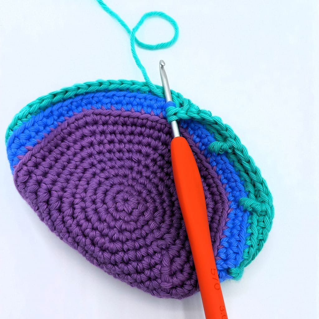 indictating the placement of the front loop only treble crochets in round 14 of the basket pattern