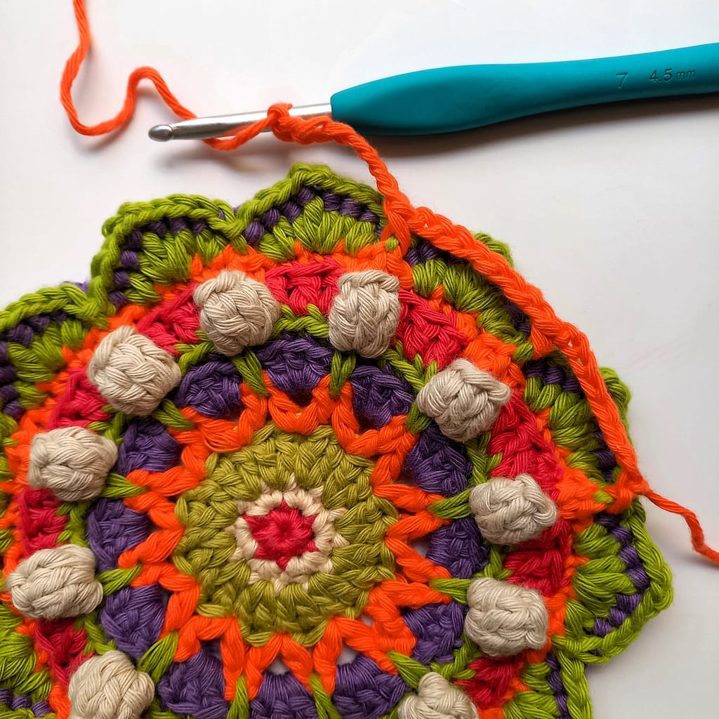 round 12 of the crochet mandala in progress