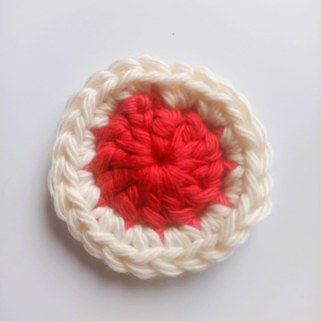 Round 2 of the crochet coaster pattern completed