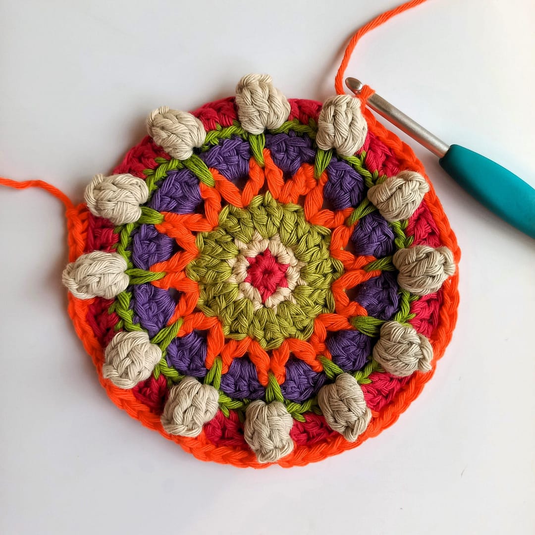 round 9 of the crochet mandala in progress