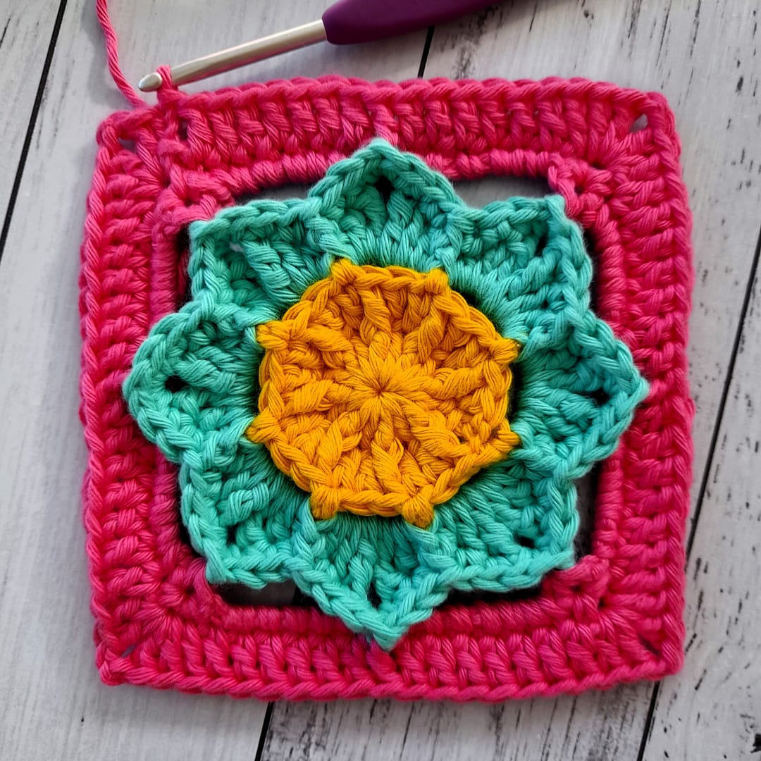 Round 8 of floral crochet granny square