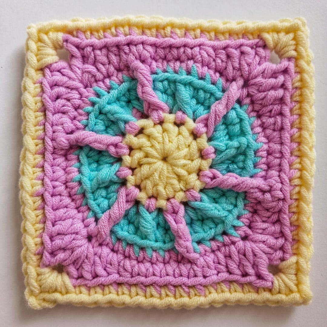 A closeup photo of how the crochet piece looks at the end of round seven of the associated crochet pattern instructrions