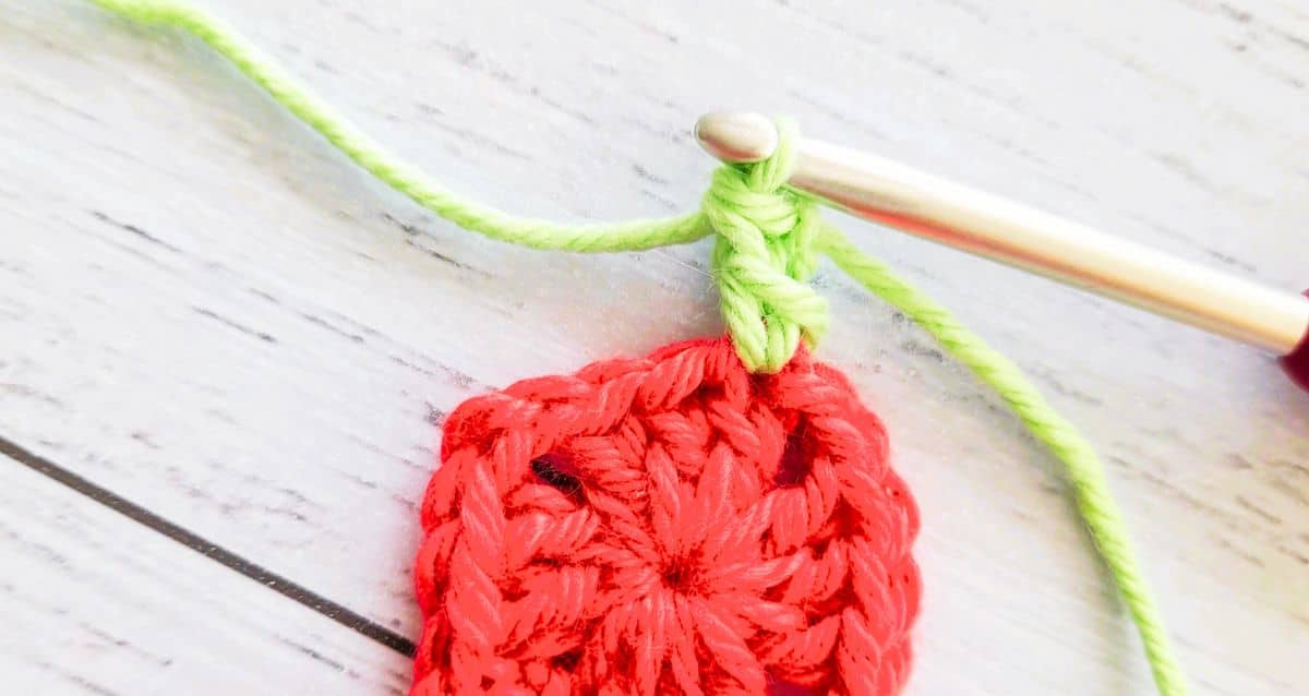 green double crochet made into tiny red crochet granny square