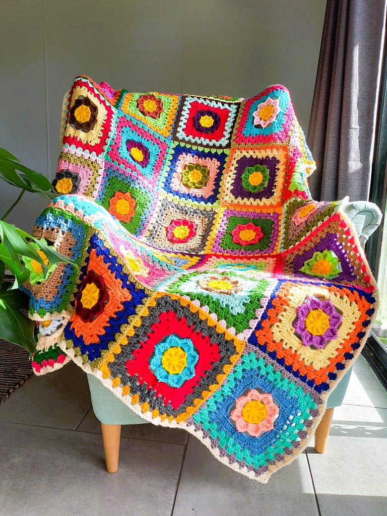 a wildly colourful crocheted granny square blanket