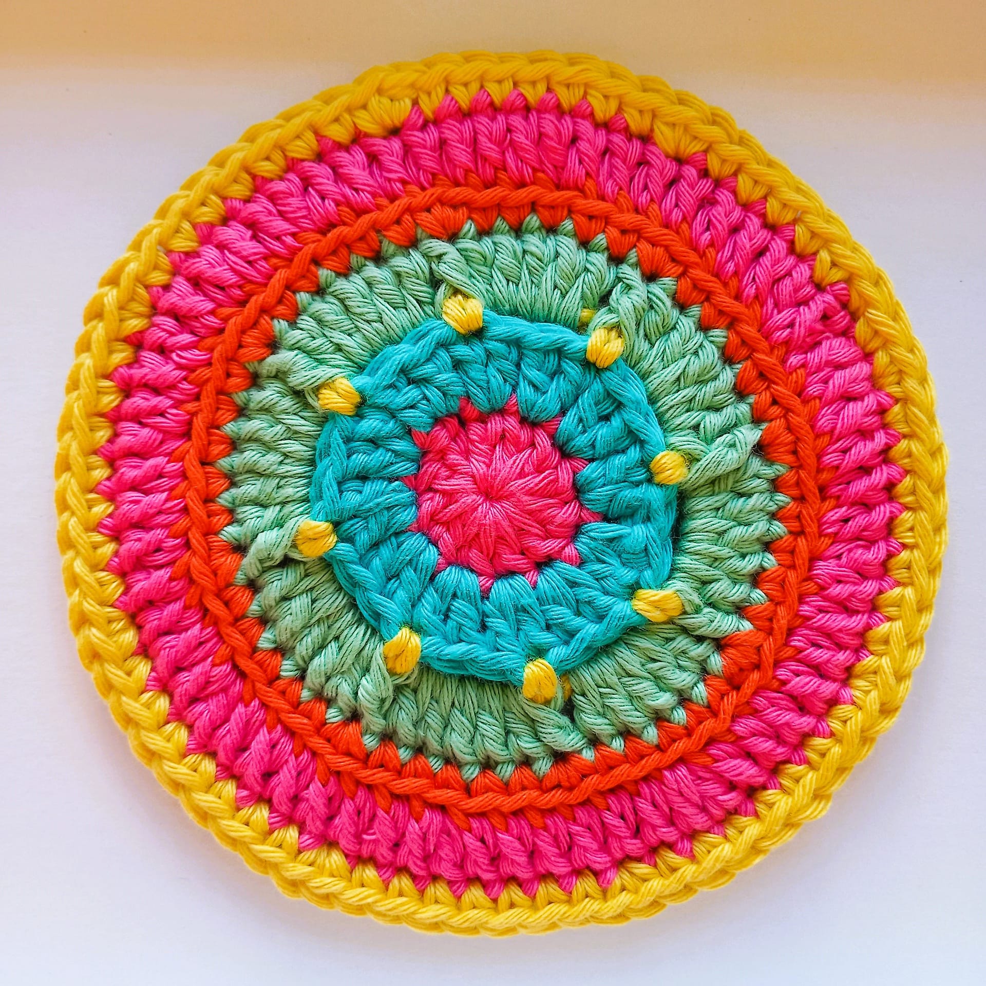 the finished free crochet coaster project